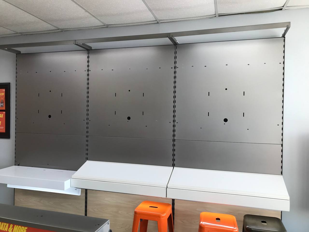 Metal shelving panels and counters staged for loading in a retail store