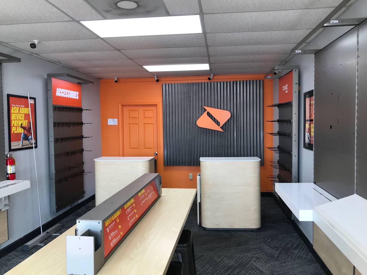 Retail store interior cleared by Clays Moving, fixtures and counters ready to move